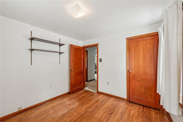 unfurnished bedroom with light wood-type flooring