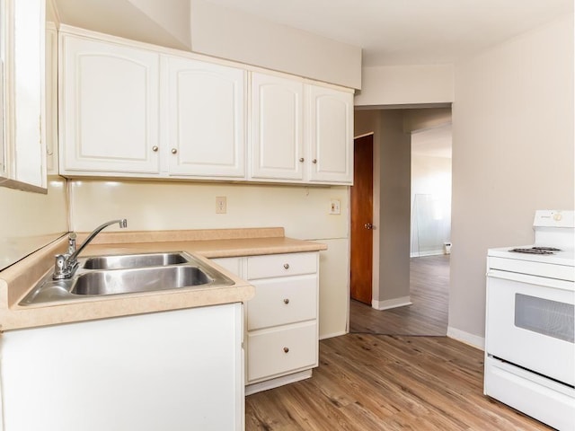 kitchen featuring sink, white cabinetry, white electric stove, and light wood-type flooring