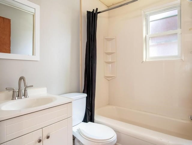 full bathroom with shower / bath combo with shower curtain, vanity, and toilet