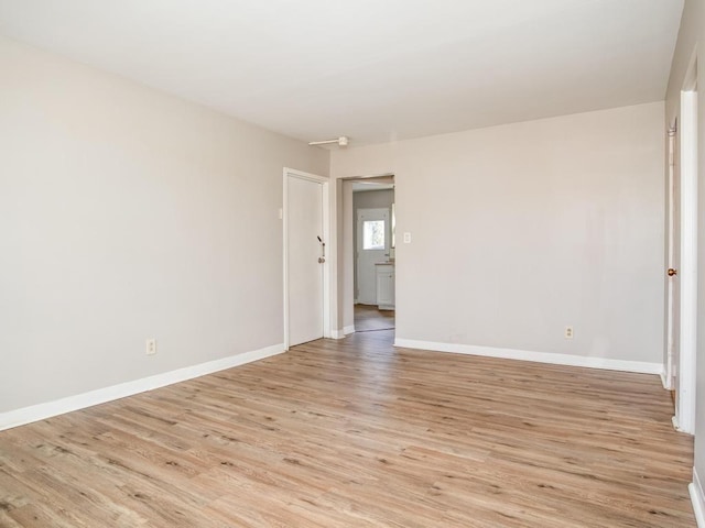 spare room with light hardwood / wood-style flooring