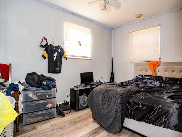 bedroom featuring light hardwood / wood-style flooring and ceiling fan