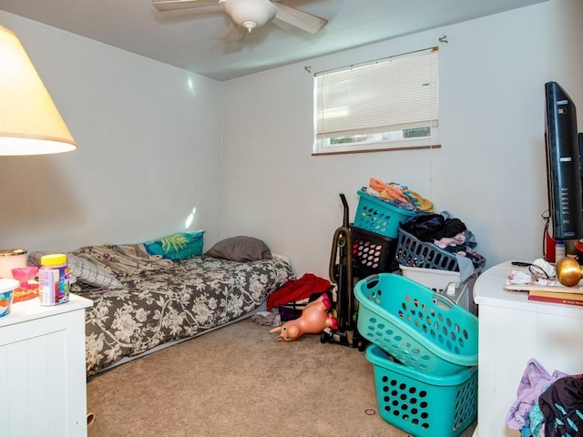 bedroom featuring light colored carpet and ceiling fan