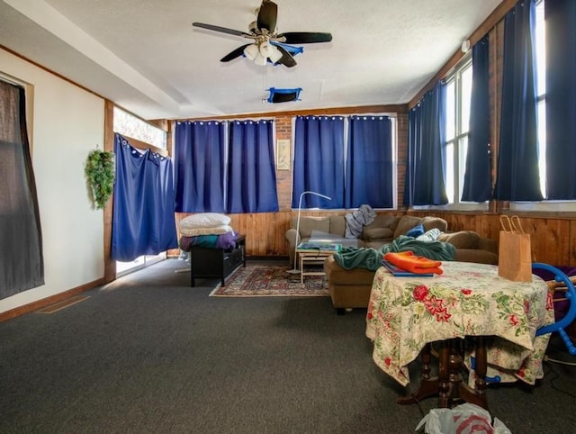 bedroom featuring ceiling fan and dark carpet