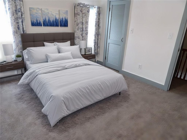 carpeted bedroom with a closet