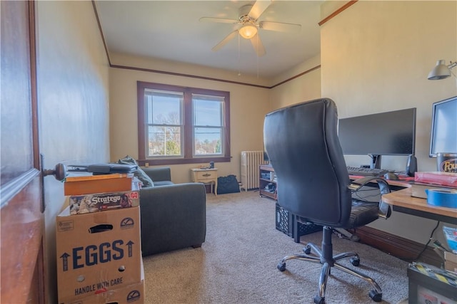 carpeted office with radiator and ceiling fan