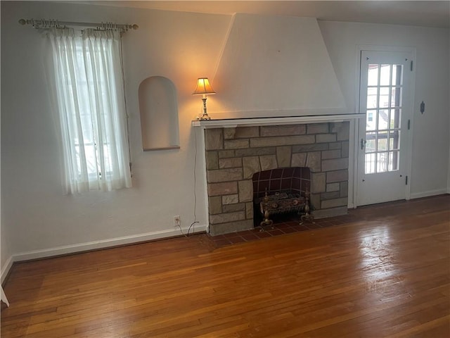 unfurnished living room featuring hardwood / wood-style flooring