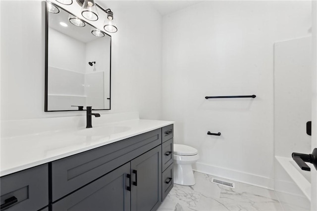 bathroom featuring vanity and toilet