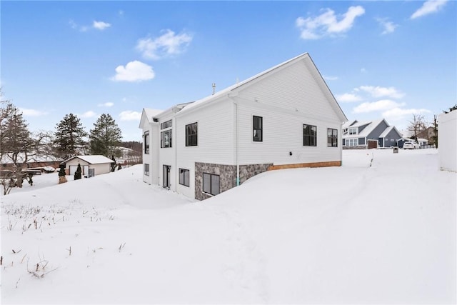 view of snow covered house