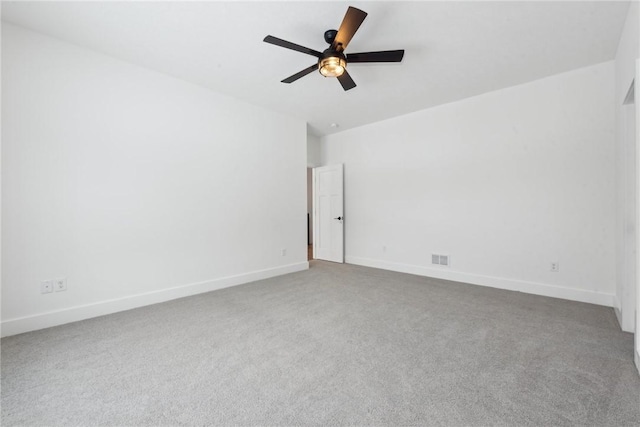 spare room with carpet flooring and ceiling fan