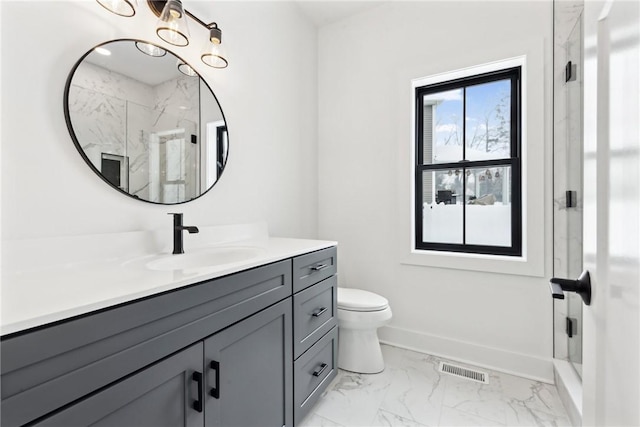 bathroom with vanity, toilet, and walk in shower