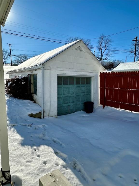 view of snow covered garage