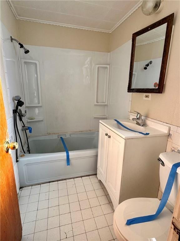 full bathroom featuring vanity,  shower combination, tile patterned floors, toilet, and ornamental molding