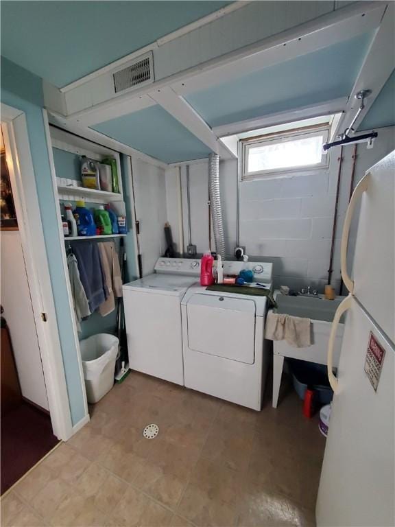 laundry room with separate washer and dryer