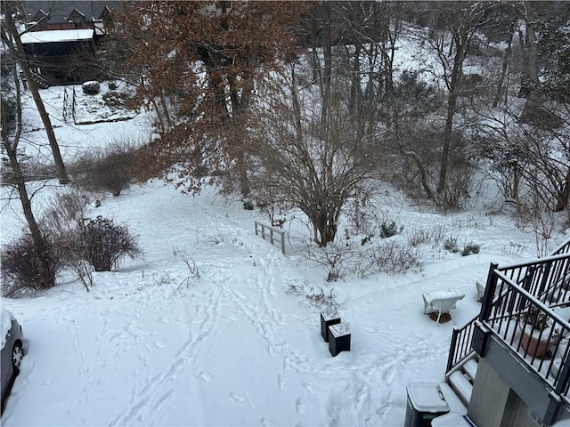 view of yard layered in snow