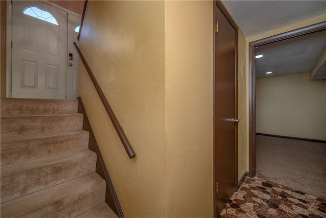 stairway with carpet floors