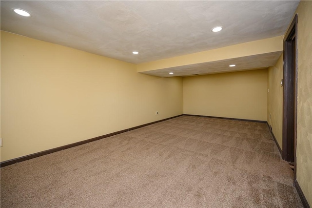 unfurnished room featuring carpet flooring