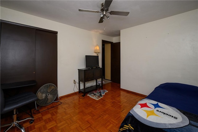 bedroom featuring parquet flooring and ceiling fan