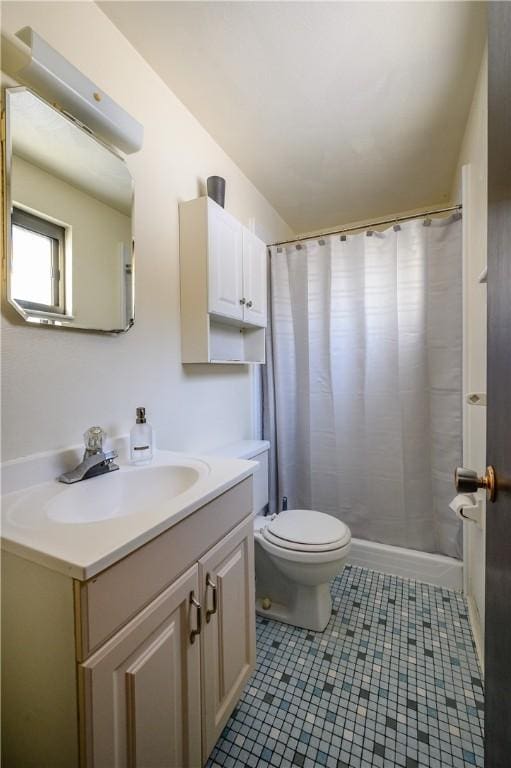 bathroom featuring tile patterned floors, vanity, toilet, and a shower with curtain