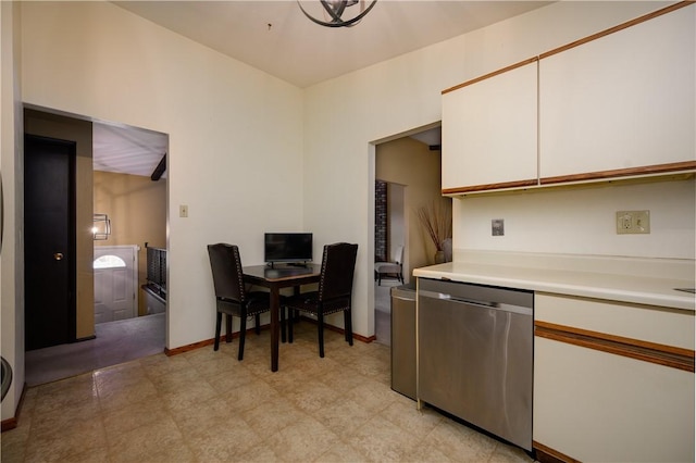 kitchen featuring white cabinets and stainless steel dishwasher