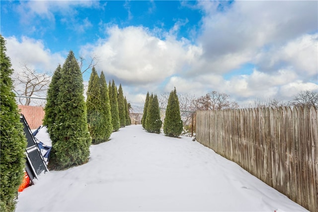 view of yard covered in snow