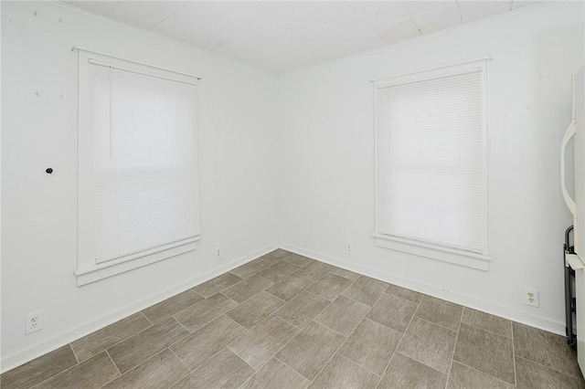 unfurnished room with crown molding