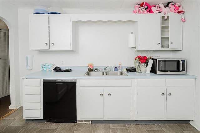 kitchen featuring black dishwasher, white cabinetry, crown molding, and sink