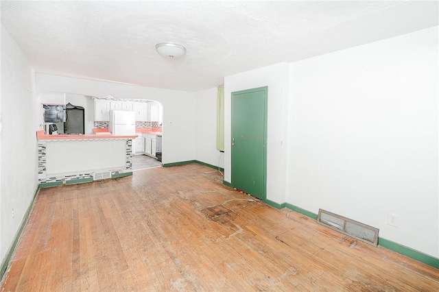 unfurnished room featuring hardwood / wood-style floors