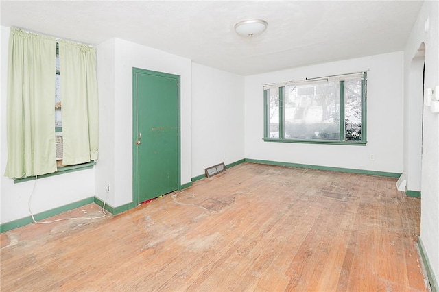 spare room with hardwood / wood-style floors