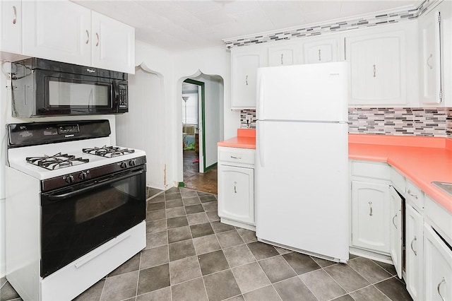 kitchen featuring white cabinets, decorative backsplash, white appliances, and crown molding