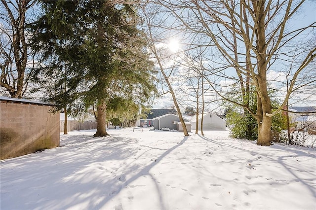 view of yard layered in snow