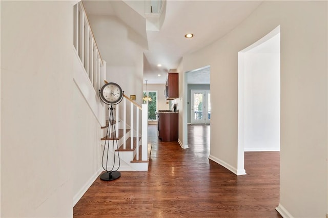 entryway with dark hardwood / wood-style floors