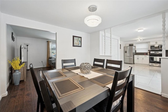 dining area with hardwood / wood-style flooring