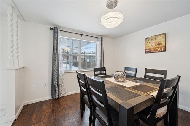 dining space with dark hardwood / wood-style floors