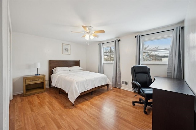 bedroom featuring ceiling fan and light hardwood / wood-style floors