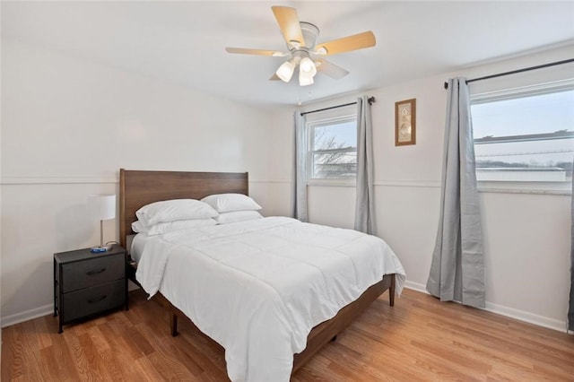 bedroom featuring ceiling fan and hardwood / wood-style flooring