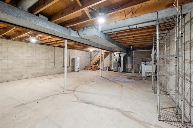 basement featuring gas water heater and heating unit