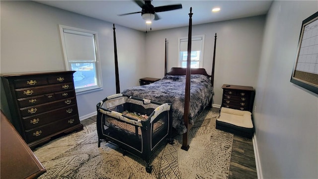 bedroom with ceiling fan and light hardwood / wood-style flooring