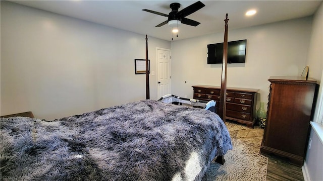 bedroom featuring ceiling fan and hardwood / wood-style floors