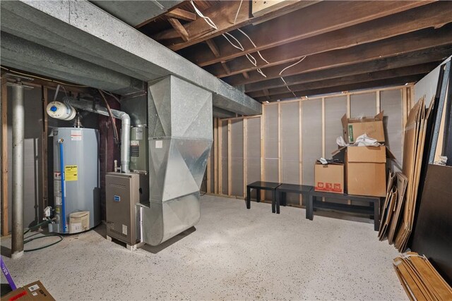 basement with heating unit and water heater