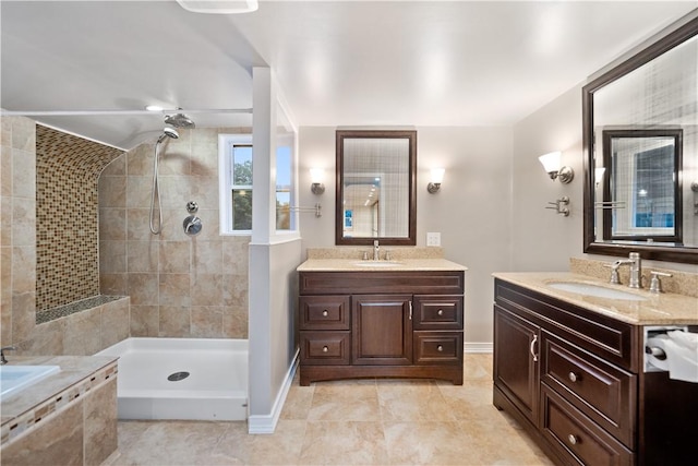 bathroom with vanity, tiled shower, and ceiling fan