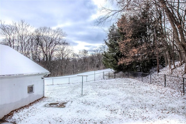 view of yard layered in snow