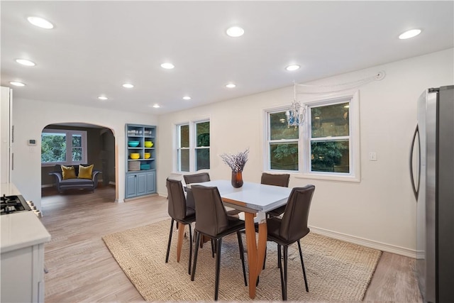 dining area featuring light wood-type flooring