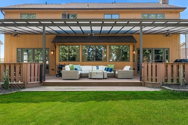 rear view of house featuring a yard, an outdoor hangout area, a pergola, and a wooden deck