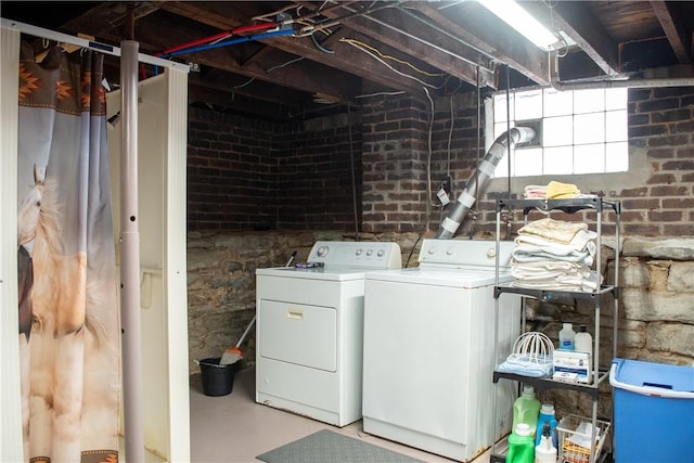 laundry area with washing machine and dryer