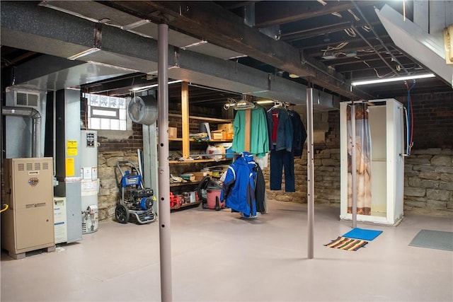 basement featuring water heater and heating unit