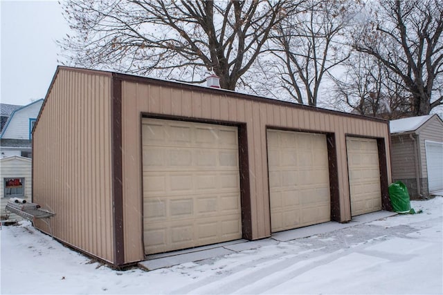 view of snow covered garage