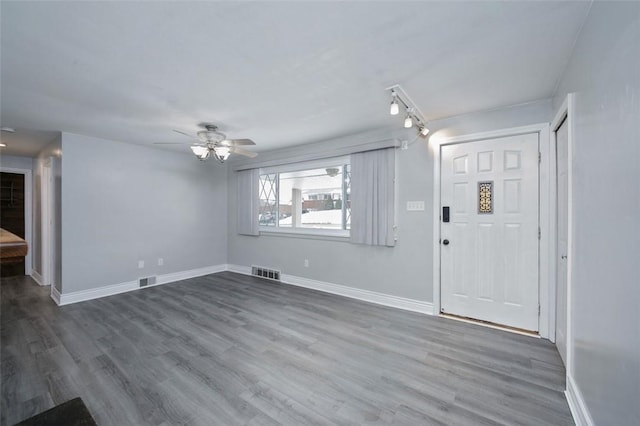 foyer with ceiling fan and hardwood / wood-style floors