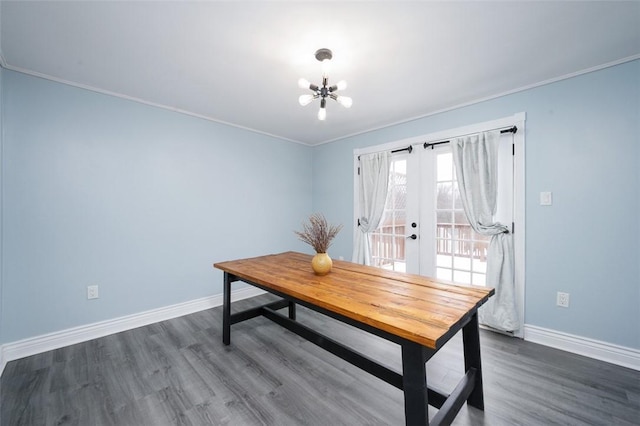 office featuring dark hardwood / wood-style floors, crown molding, french doors, and an inviting chandelier