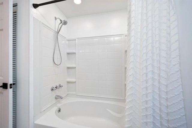 bathroom with shower / bathtub combination with curtain