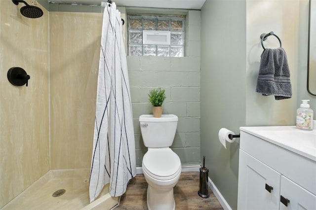 bathroom featuring hardwood / wood-style floors, toilet, vanity, and a shower with shower curtain